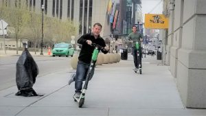 People riding rented scooters
